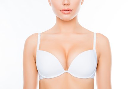 Tampa Breast Augmentation Model wearing a white bra