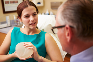 Tampa Breast Augmentation model having a consultation with plastic surgeon