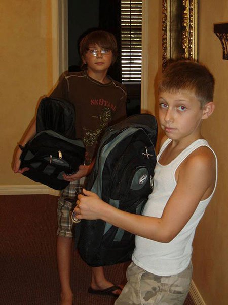 two boys with backpacks